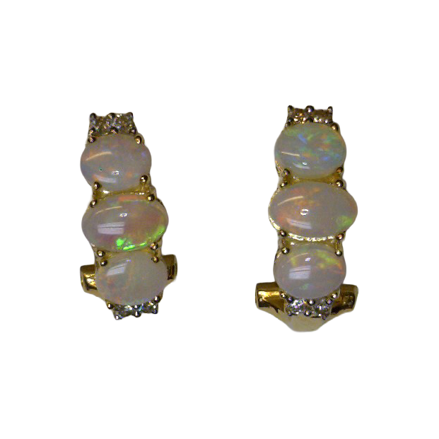 Two earrings, each with three vertically stacked oval opal cabochons and small diamond accents at the upper and lower ends.