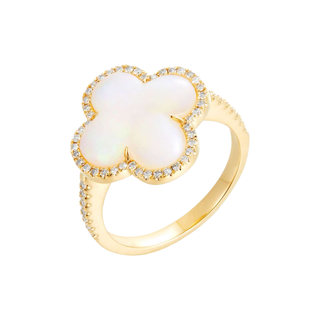 Opal and diamond ring in yellow gold with a clover-shaped center, halo and stone-set shoulders, shown at an oblique angle.