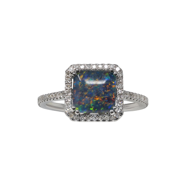 Opal ring with a softly rounded, near-square center stone, surrounding halo and accented shoulders.