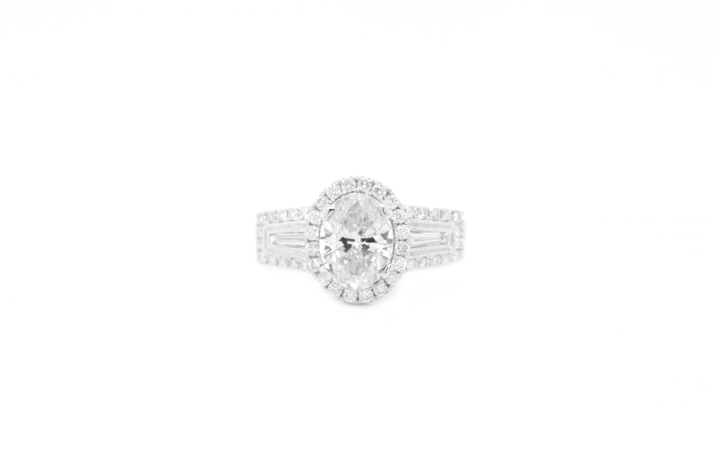 3 Stone Oval Halo and Tapered Baguette Split Shank Engagement Ring
