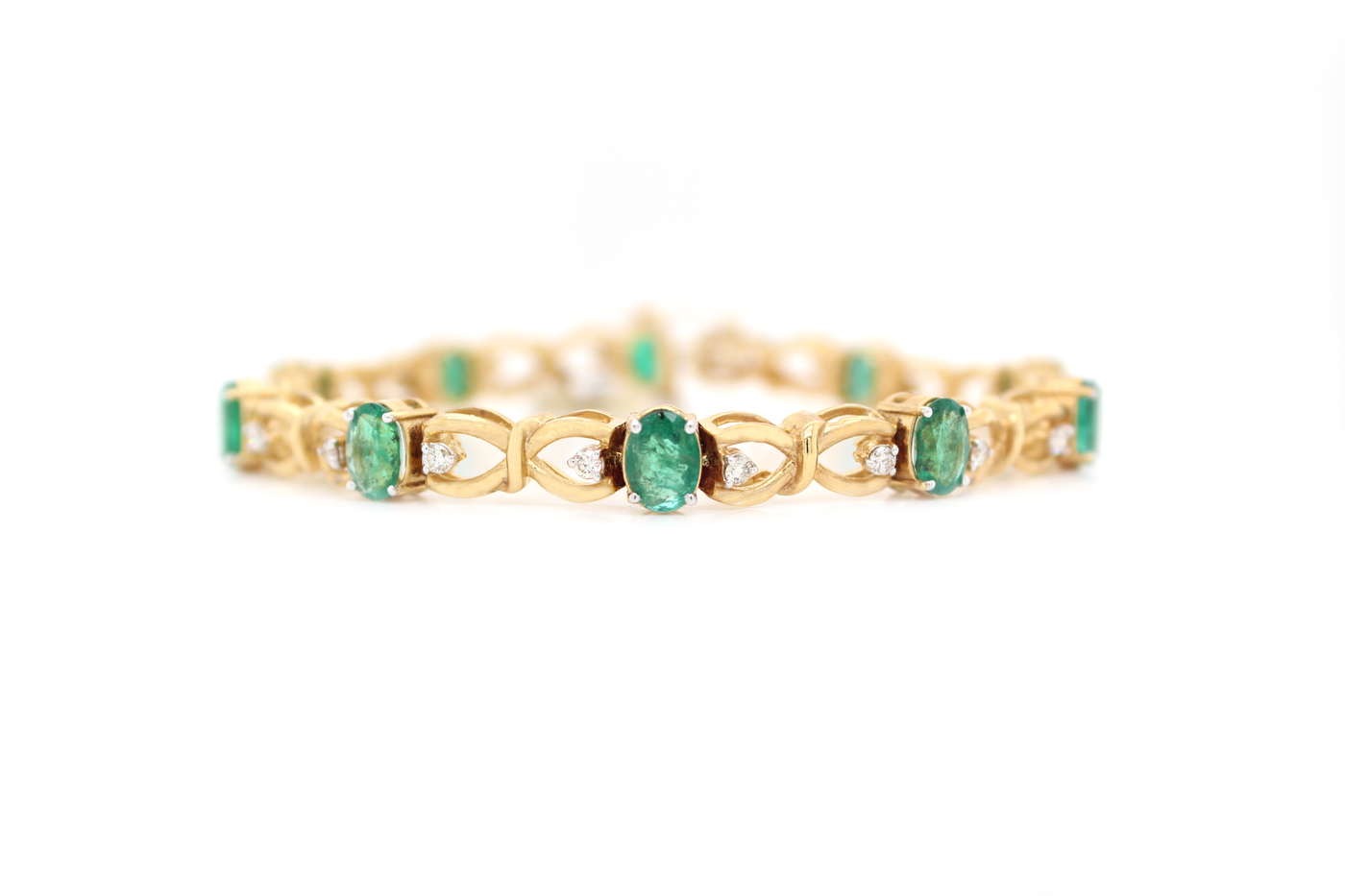 Oval Emerald and Diamond Infinity Knot Tennis Bracelet