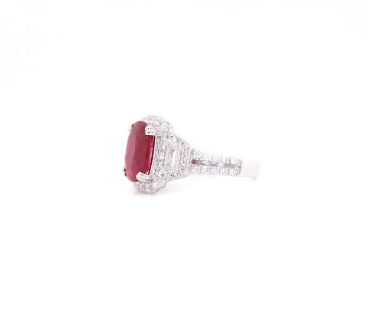 3.70ct Oval Cut Ruby and Diamond Halo with Tapered Baguettes Ring