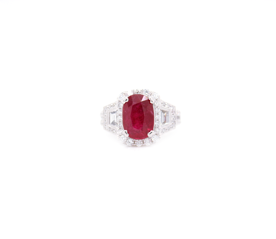 3.70ct Oval Cut Ruby and Diamond Halo with Tapered Baguettes Ring