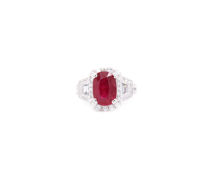 3.70ct Oval Cut Ruby and Diamond Halo with Tapered Baguettes Ring